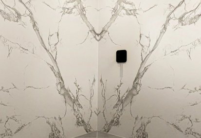 White quartz kitchen countertops over oak cabinets